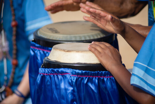 Candomble religious people are seen playing atabaque on the day of honor to Iemanja on Rio Vermelho beach, city of Salvador, Bahia.