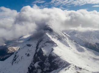 Fototapeta na wymiar Aerial view of mountains. Snowy mountain range. The Andes Mountains. South American winter travel.