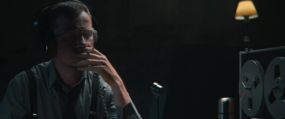 An intelligence officer is working at the wiretap station 