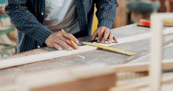 Hand, woodwork and ruler for measurement in workshop for furniture manufacturing, renovation or small business. Person, fingers and pencil with plank for timber creativity, carpentry or production
