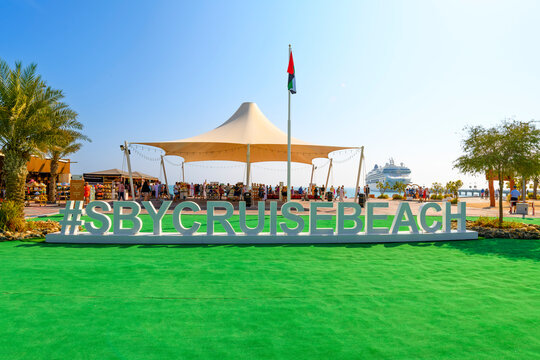 General view of the hashtag welcome sign, cruise ship, and tourist tents selling gifts, on Sir Bani Yas Island, a wildlife sanctuary and resort in United Arab Emirates on January 8 2024.