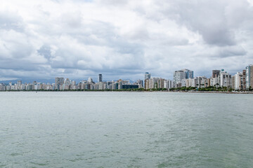 Stretching Urban City Skyline of Santos Sao Paolo Brazil Under Storm Clouds