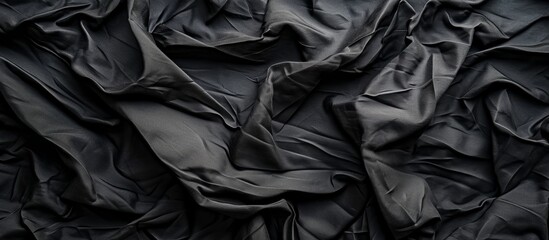 Black crumpled fabric texture background