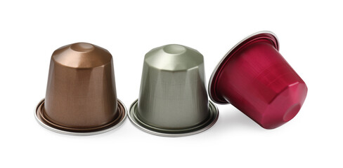 Three plastic coffee capsules isolated on white