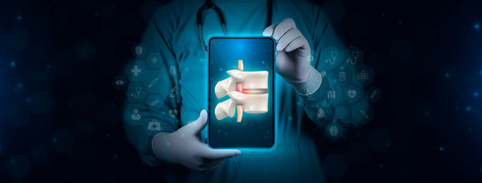 The doctor analyzes the image of a spinal hernia, herniated disc. Surgeon with tablet on digital technology background.