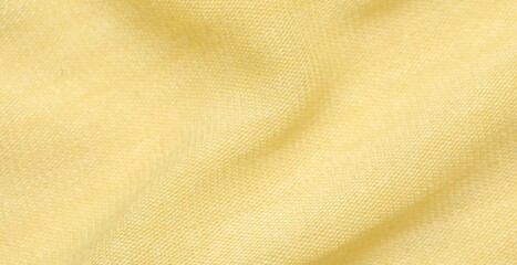 Texture of bright yellow fabric as background, closeup