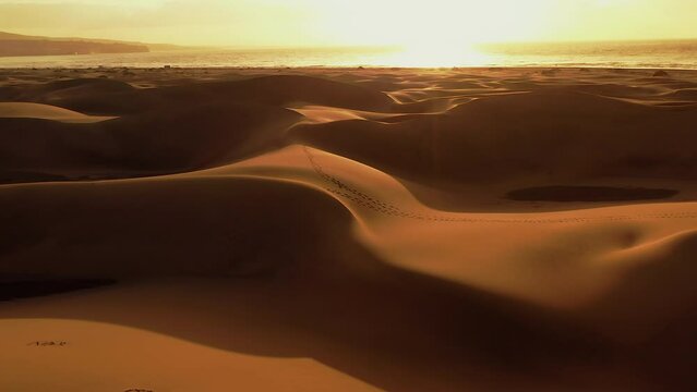 Drone Flight over the Dunes of Maspalomas at Sunrise