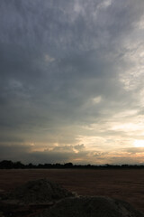 Obraz premium Sky during overcast, storm at evening. Include many gray clouds, empty space, light nature, sunset sunrise, horizon skyline, land or landscape at outdoor for background. Concept of disaster, danger.