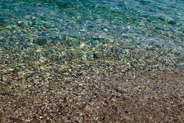Beautiful pebble beach with turquoise sea in Turkey