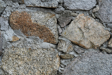 Stone on exterior wall of historic structure.