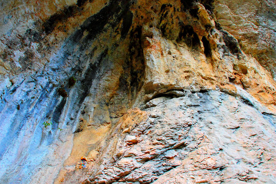 Majestic scenery from Grotta di Soffiano at Eremo di Soffiano near Sarnano in the Sibillini Mountains, the imposing rockface from the hermitage's cave showing its rugged complexion and a manger scene