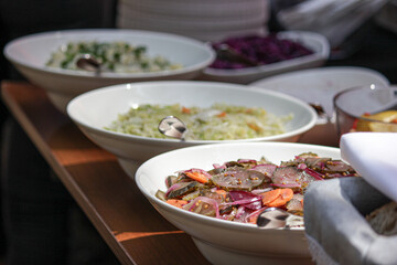 vegetable salads, Preparation of dishes for an all-inclusive banquet in a resort hotel. Empty all inclusive line, restaurant equipment.