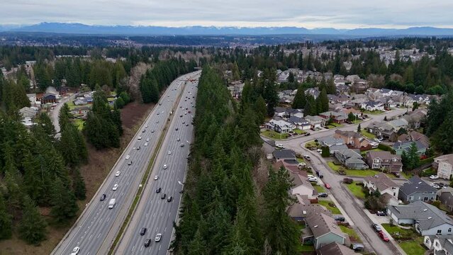 Aeiral view travelling south of suburban homes near 405 in Snohomish County