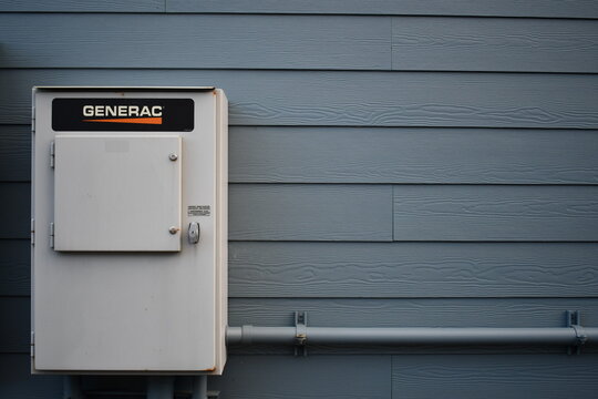 Generac power switch gear mounted on building.