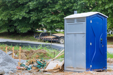 During construction of home portable temporary toilet is placed on construction site