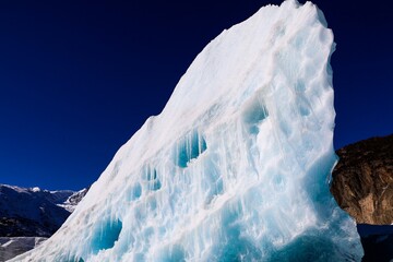 Discover the majestic beauty of Tibet as towering seracs grace the Laigu Glaciers against a backdrop of vibrant blue skies. A breathtaking testament to the raw power and tranquility of nature.