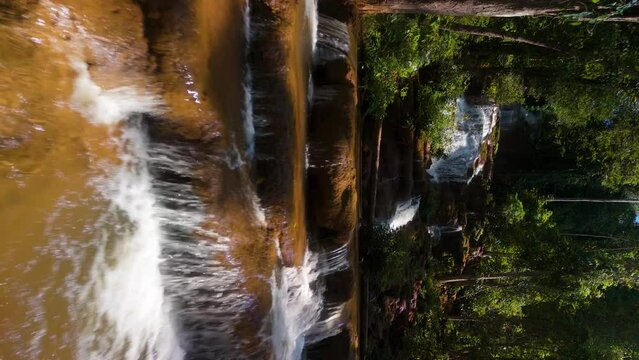 Waterfall in the Rainforest, Soft Light on the Trees Flora Fauna, Ecosystem Natural Habitat, Water flowing down Limestone Rocks, Limestone Waterfall Slow Motion, 9:16 True Vertical 4k Video