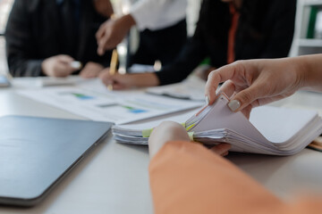 Businesswoman hands working in stacks of paper files for searching, business employee woman working...