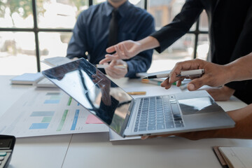 group of employees is discussing the details of an upcoming event, close-up view of the meeting...