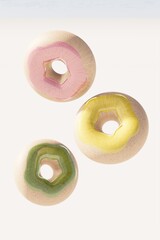 Three floating donut buns