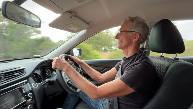Portrait Of An Australian Man Driving From Bunbury to Perth City In Western Australia. POV