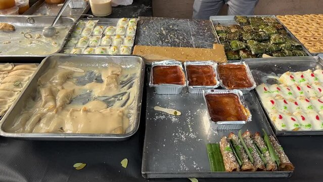 No face video of tasty traditional sweets kept in a roadside sweet shop in Kolkata, India.