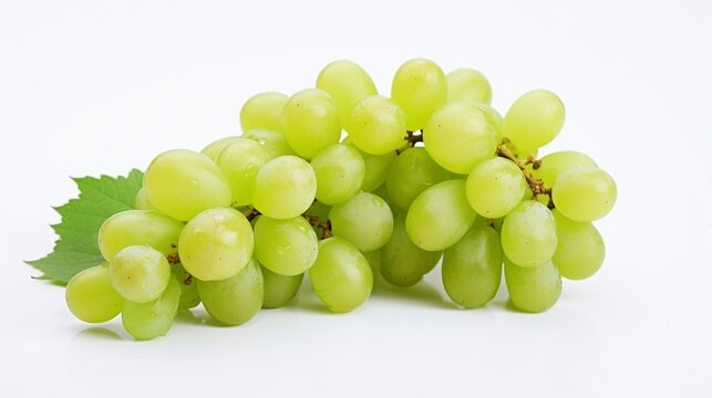 Bunch of green grapes with leaves isolated on a white background.