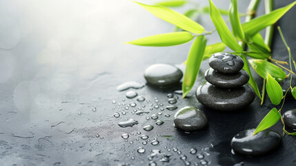 Spa background with zen stones and green bamboo leaves.  Blank empty copy space, stone or marble background. 