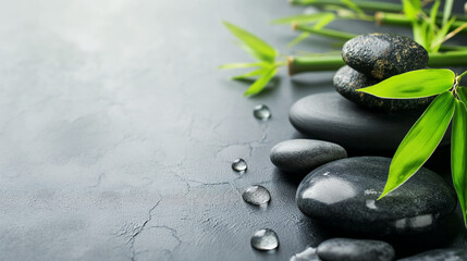 Spa background with zen stones and green bamboo leaves.  Blank empty copy space, stone or marble...