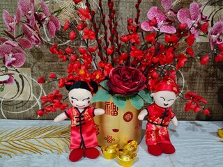 Two traditional Chinese dolls for Chinese New Year decoration. Selective focus