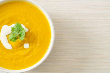 pumpkin soup in white bowl