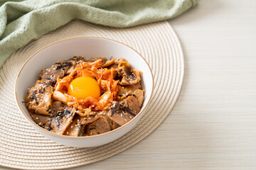 pork bulgogi rice bowl with kimchi and Korean pickled egg