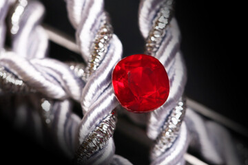 Close-up of a red and silver bracelet, featuring a detailed chain, a stunning jewelry piece with gold, pearls, and diamonds, a beautiful accessory perfect for Christmas, gifting, and luxury fashion