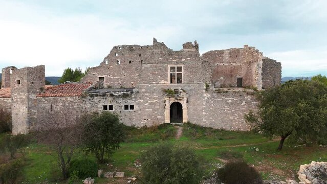 Aerial dolly shot revealing the remaining ruins of Montlaur Castle, Montaud 