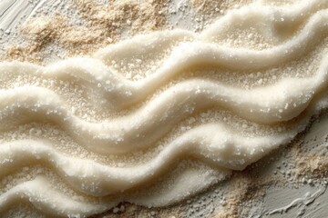 Obraz premium Abstract textured wavy cream colored background, the texture of the background in a luxurious style.