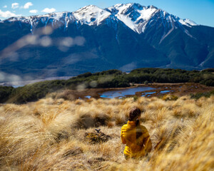 hiker girl walking on a bealey spur track in arthur's pass national park, canterbury, new zealand;...