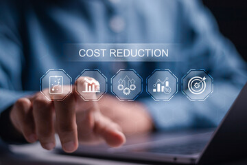 Cost reduction business finance concept. Businessman use laptop with virtual cost reduction icon...