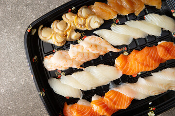 Different types of sushi on a plate	