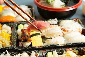 sushi with chopsticks	