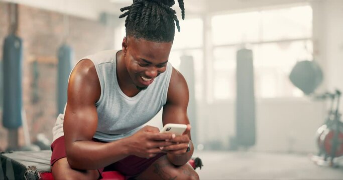 Black man, phone and gym for fitness, workout or training break on social media and chat with health tips or progress. Happy bodybuilder typing on mobile in communication, network or exercise sign up