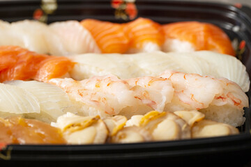 Different types of sushi on a plate	