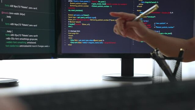 Slow motion closeup hand, back end software developer engineer for computer programming working together on debugging writing computing code, solving complex algorithms display on monitor. Burgeoning