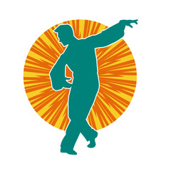 Silhouette of a slim man dancing pose. Silhouette of a male dancer in action pose.