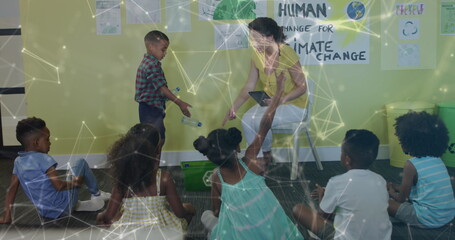 Image of networks over happy diverse female teacher and schoolboy recycling in ecology class