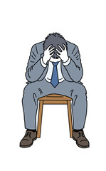 頭を抱えている男性