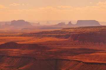 Spectacular afternoon view of the Goosenecks of the San Juan river and the distant buttes and mesas...