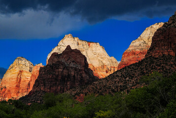 Dramatic sunset on the white sandstone summits of the Mountain of the Sun, Twin Brothers and East Temple of Zion National Park, Springdale, Utah, southwest USA.