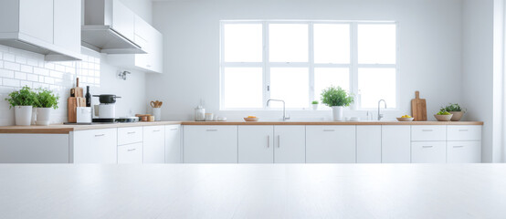 Empty tabletop, displaying product on white tabletop over blurred modern white kitchen. empty table top of kitchen island on white modern kitchen interior background.