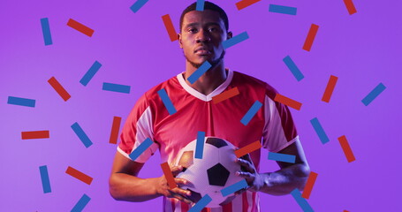 Image of african american male soccer player over confetti