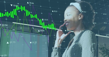 Image of data processing over african american businesswoman working at office